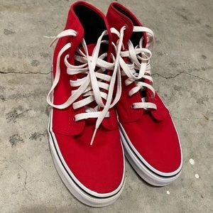 Vans “High-Top” Sneakers.